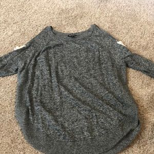 Grey top with shoulder slots & cross pattern